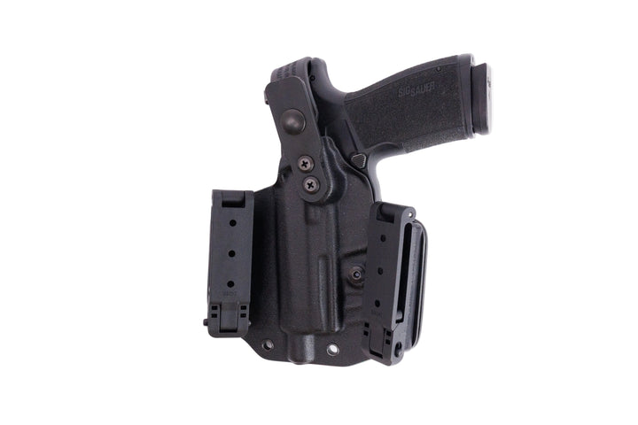 Black gun holster with magazine on a white background